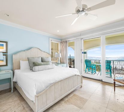 First Floor Bedroom with King Bed, 43" TV, Wet Bar with Beverage Cooler & Keurig, Ensuite Bath, Elevator Access & Covered Balcony Overlooking the Splash Pool and Gulf.