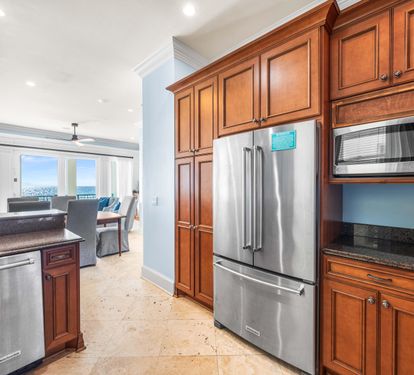Kitchen with a View!! Second Floor Fully Stocked  with Granite Countertops, Stainless Steel Appliances including Viking Range, KitchenAid Refrigerator, and Under-Counter Ice Maker.