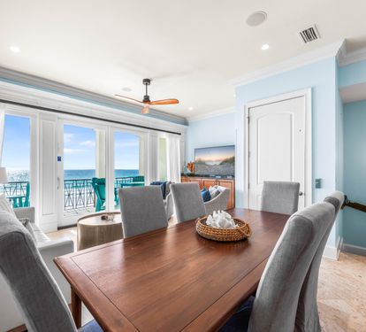 Elevator Access in the 2nd Floor Living/Dining Area with 65" Smart TV with Cable, Dining Table for 6 & Bar Seating for 2.  Covered balcony with outdoor seating and dining table for 6 - all with Gulf Views!