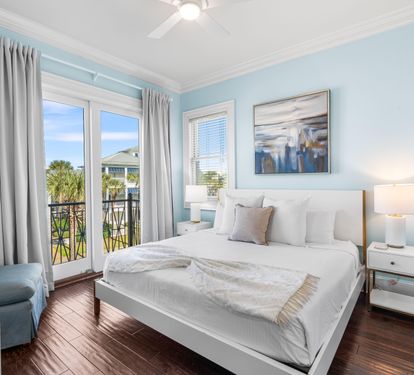 Third Floor Bedroom with King Bed, 40" TV, Ensuite Bathroom with Bathtub/Shower Combination & Balcony Overlooking the Frangista Beach Community.