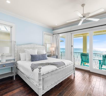 Third Floor Primary Suite with King Bed, Elevator Access, 50" TV, Wet Bar with Viking Beverage Cooler & Keurig, Ensuite Bathroom & Covered Balcony with Seating Overlooking the Gulf.