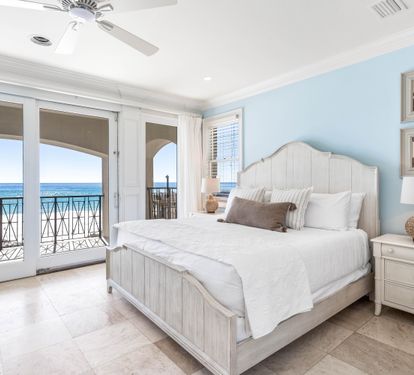 First floor bedroom with king bed, ensuite bathroom and wet bar overlooking the splash pool and Gulf.