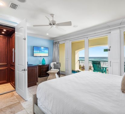 First floor bedroom with king bed, ensuite bath, 50" tv, elevator access with views of the splash pool and Gulf.