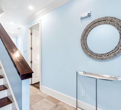 First Floor Level Leads to the King Bedroom and 4 Queen Bed Bunkroom. Stairs lead to the Second Floor Main Living and Kitchen Area.