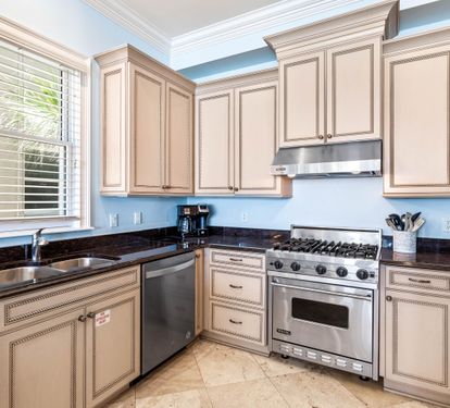Amazing Kitchen with a Viking Gas Range, Stainless Steel Appliances, Granite Countertops and Custom Cabinetry.  Separate Ice Maker for Filling Up your Cooler!