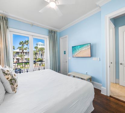 Second Floor Bedroom with king bed, ensuite bathroom, and balcony overlooking the Frangista Beach community.  Walk-in closet and 42" tv.