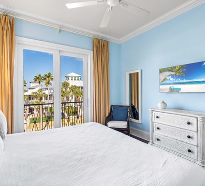 Third floor bedroom with king bed, ensuite bathroom, 42" smart tv and views of the Frangista Beach community.