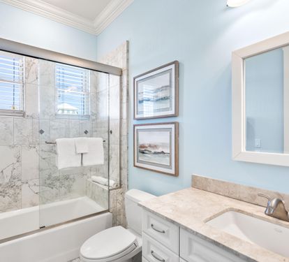Third floor ensuite bathroom for the guest king bedroom with a bathtub/shower combination.
