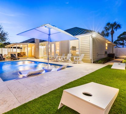 Large Private Pool with Sunshade, in Pool Lounge chairs!! Spacious Pool Deck with a Fire Pit and covered Dining Area!! This Backyard is Completely Enclosed, Corn Hole!!