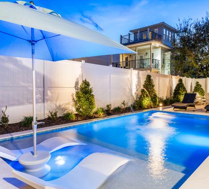 Large Private Pool with Sunshade, in pool lounge chairs!! Spacious Pool Deck with a Fire Pit and covered Dining Area!! This Backyard is Completely Enclosed. Beach Oasis- Destin, FL