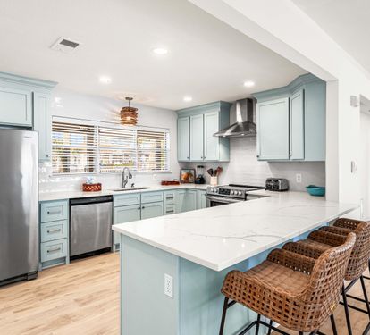 Quartz Counters with Stainless Steel Appliances and Seating for 3.