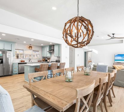 This Dining Table can Handle the Entire Group Seating 10!! Plus 3 More on the Kitchen Bar and a Pool View!!
