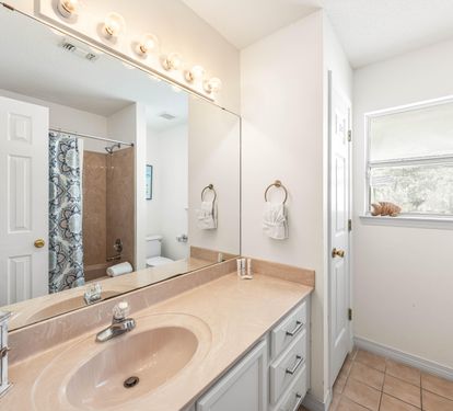 Both the Bunkroom and Guest King Bedroom Share this Single Vanity Bathtub and Shower Combination.