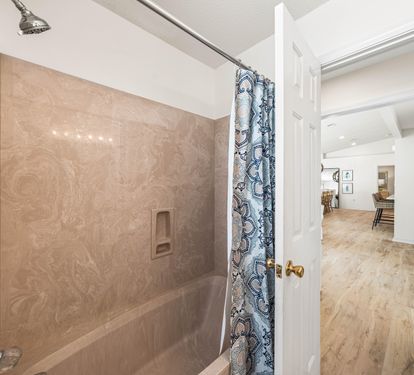 Both the Bunkroom and Guest King Bedroom Share this Single Vanity Bathtub and Shower Combination.