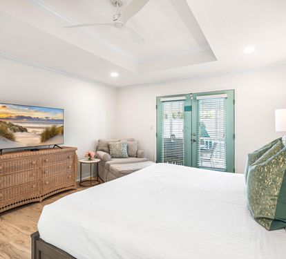 This Primary King Bedroom also has Access to the Outdoor Covered Dining Area and Pool.