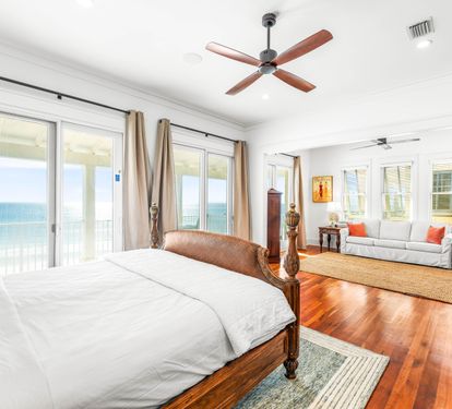 Huge primary king-size bedroom on the 3rd level with private beachfront balcony, queen sleeper sofa, armoire with tv, elevator access, & stunning primary ensuite bathroom.