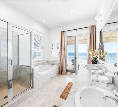 Walk-in shower, jetted tub, two sinks, marble vanity and one stunning view!   This is your primary ensuite bathroom on the 3rd floor