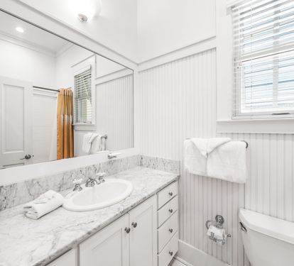 Ensuite bathroom for 3rd floor northeast queen  bedroom.  Marble vanity and bathtub/shower combination.