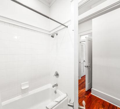 Ensuite bathroom for 3rd floor northeast queen  bedroom.  Marble vanity and bathtub/shower combination.