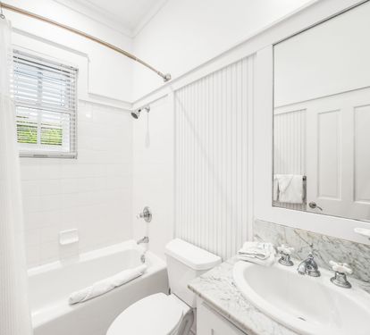 Ensuite bathroom for 3rd floor northwest queen  bedroom.  Marble vanity and bathtub/shower combination.