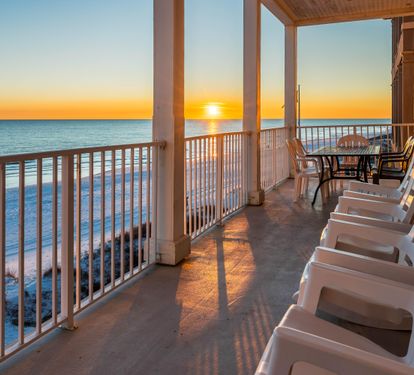 Order up 1 fabulous sunset with your rocking chairs plus outdoor dining table on this 2nd floor balcony!