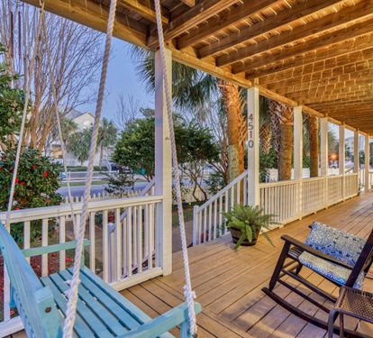 Beautiful wraparound porches with plenty of seating and a porch swing make evening especially dreamy!