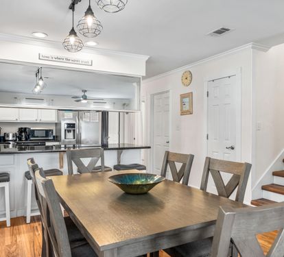 Seating at the dining table for 6 with 4 bar stools.
