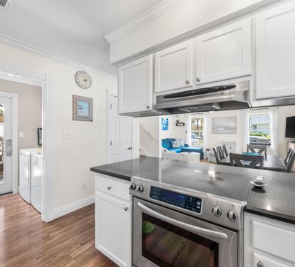 Just off the kitchen area is the separate laundry room.