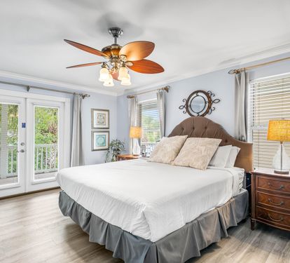 King bedroom #2 on the 2nd floor with balcony access, full bathroom & 38" smart tv.