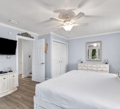 2nd floor King Bedroom #3 is the primary bedroom suite on the second floor with 42" smart tv, balcony access and ensuite bathroom.  Bonus mini-refrigerator with coffee setup.