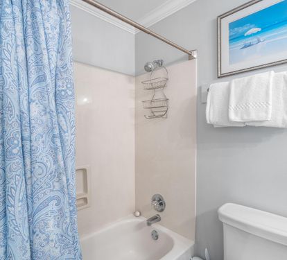 Ensuite bathroom for bedroom #3 with shower/bathtub combination.