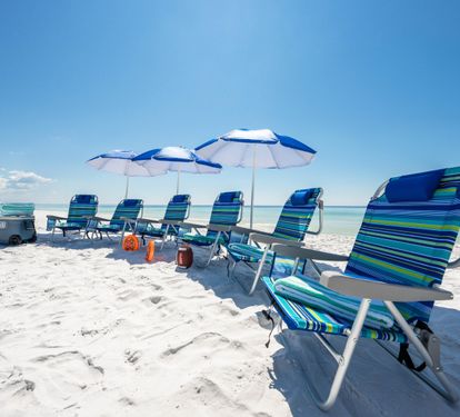 An Additional 6 Beach Chairs and 3 umbrellas in the home with Beach Cooler