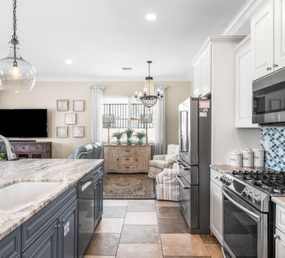 Fully Stocked Kitchen with Stainless Steel Appliances