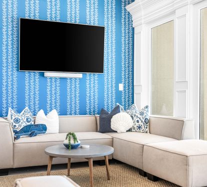 Second Floor Living area with Two Sectional Sofa's Offering a Better Seating Space. A Large Smart TV to Catch all the Favorite's