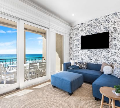 Second Floor Living area with Two Sectional Sofa's Offering a Better Seating Space. A Large Smart TV to Catch all the Favorite's