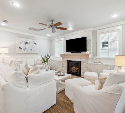 Spacious Living Area with Flat-Screen TV & Fireplace