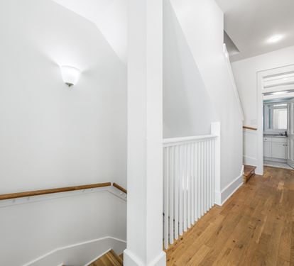 Hallway Between the two bedrooms on the Third Floor and Stairs Leading the the Second Floor Living and Dining Area.