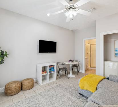 Living Area - Offering a Mini Fridge, Flat-Screen TV & Dining for 2!