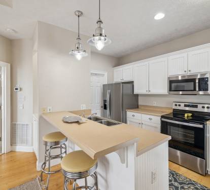 Offering Stainless Steel Appliances & Bar Seating for 2