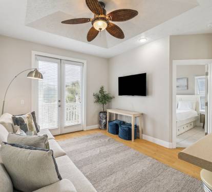 Cozy Living Area - Offering a Flat-Screen TV & Balcony Access