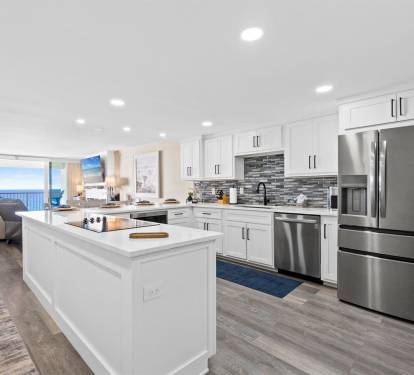 Your gourmet kitchen features granite countertops, stainless appliances, and stunning ocean views that make cooking a joy.