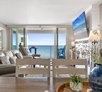 Wake up to breathtaking ocean views from your living room, where floor-to-ceiling windows frame the endless blue horizon.