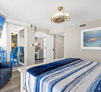 Drift into ocean dreams in your coastal bedroom with comfortable seating and serene sea turtle artwork creating the perfect beach getaway.