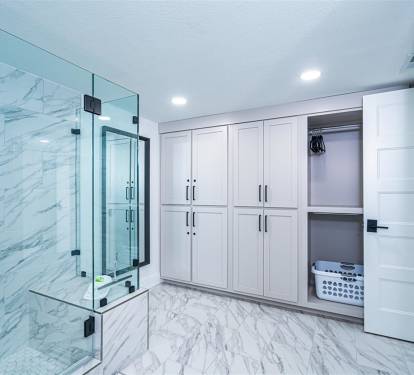 Your luxurious marble bathroom features a spacious glass shower, built-in wardrobes, and washer-dryer for ultimate convenience.