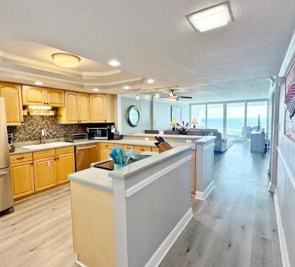Your spacious kitchen opens to the living area, where ocean views frame every meal you'll prepare and share together.