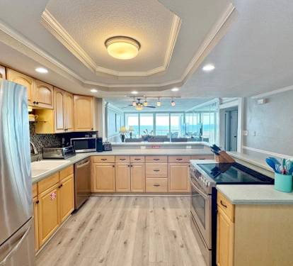Your spacious gourmet kitchen features ocean views, premium appliances, and everything you need to create memorable meals during your stay.