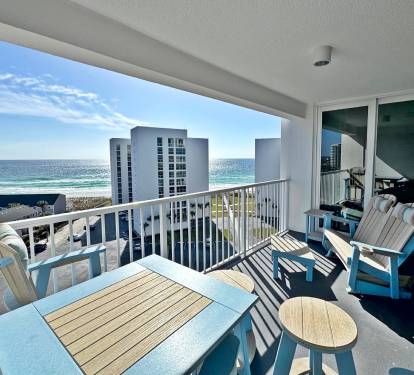 Your private oceanfront balcony offers comfortable seating where you can savor morning coffee with stunning sea views.