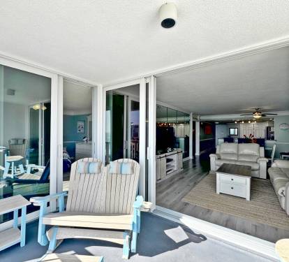 Step onto your private balcony and enjoy seamless indoor-outdoor flow. Relax on coastal-style seating while gazing into your spacious living area.