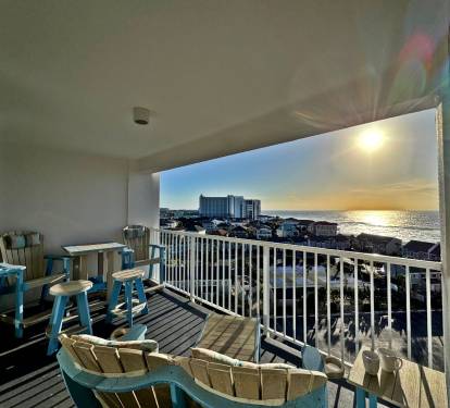 Relax on your private balcony with stunning sea views and comfortable seating as golden sunlight dances across the water.