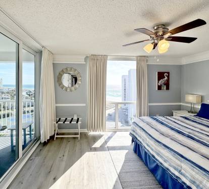 Wake to stunning ocean views from your private balcony in this elegant bedroom with coastal charm and modern comfort.